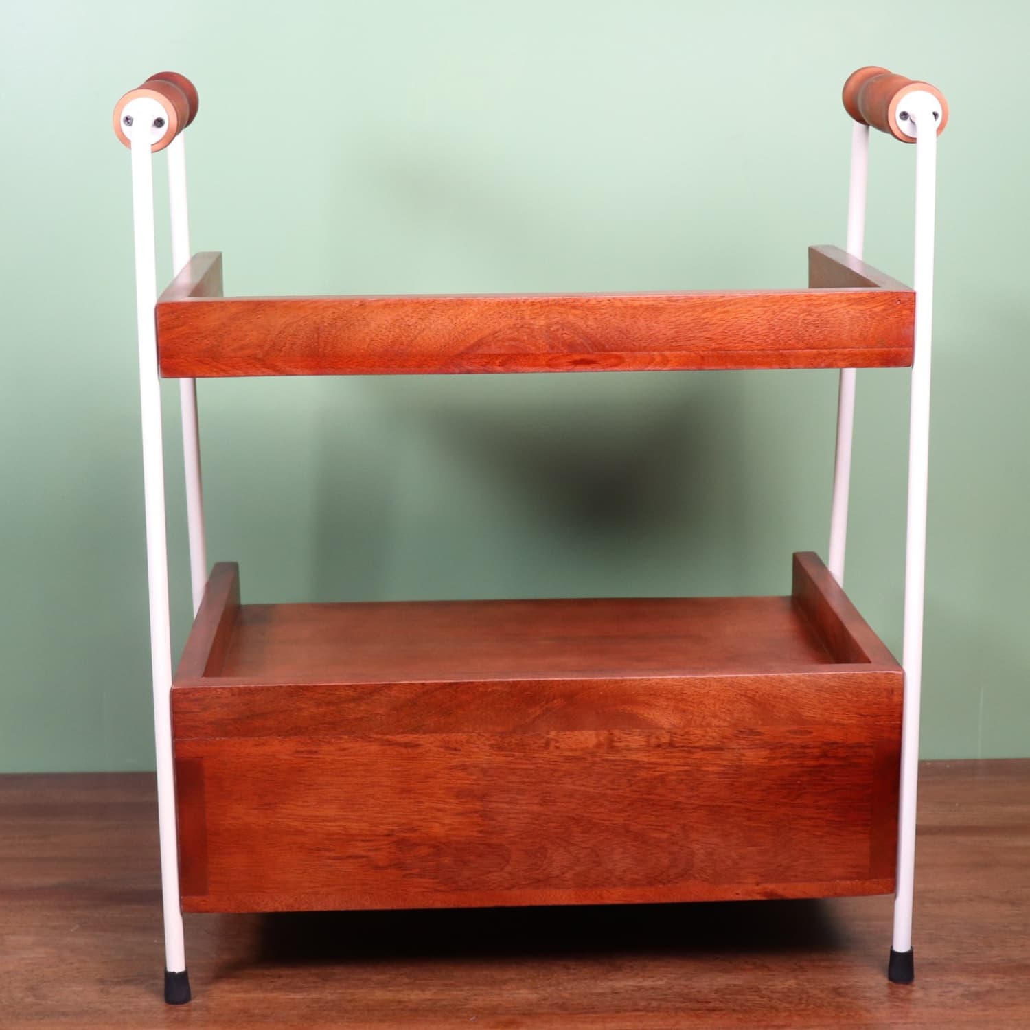 loosebucket Wooden shelf with white legs against a green wall