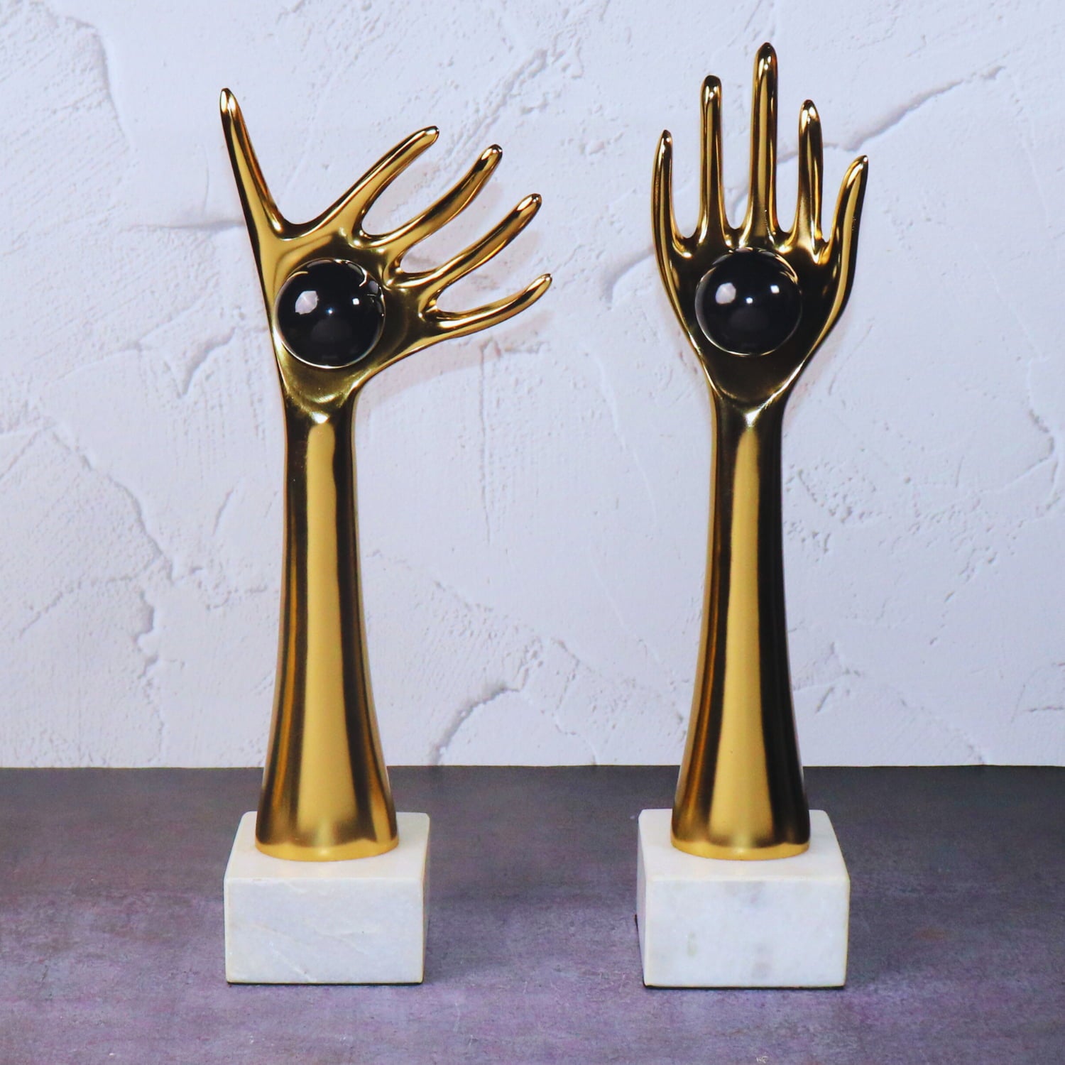 The Golden auspicious hands holding balls in aluminum set of 2