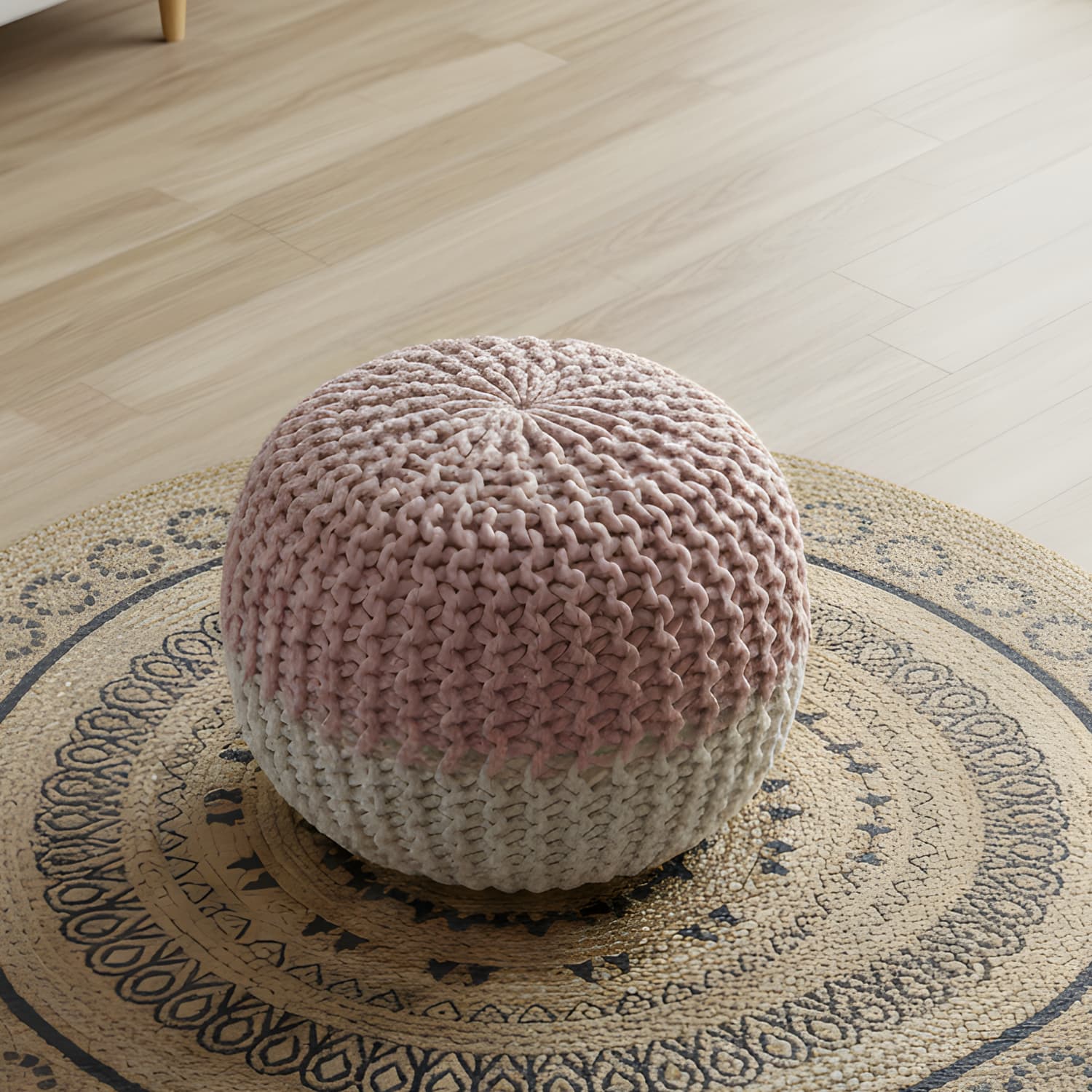 Loosebucket  Knitted pink pouf on a patterned rug in a room setting
