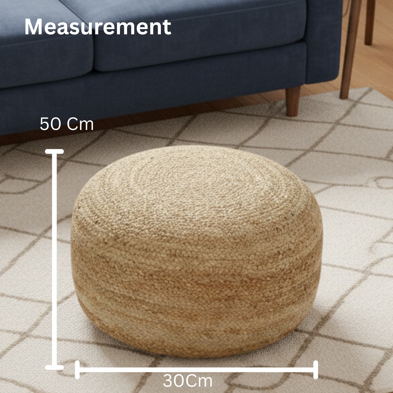 Loosebucket Beige pouf with measurements on a patterned rug in a living room setting