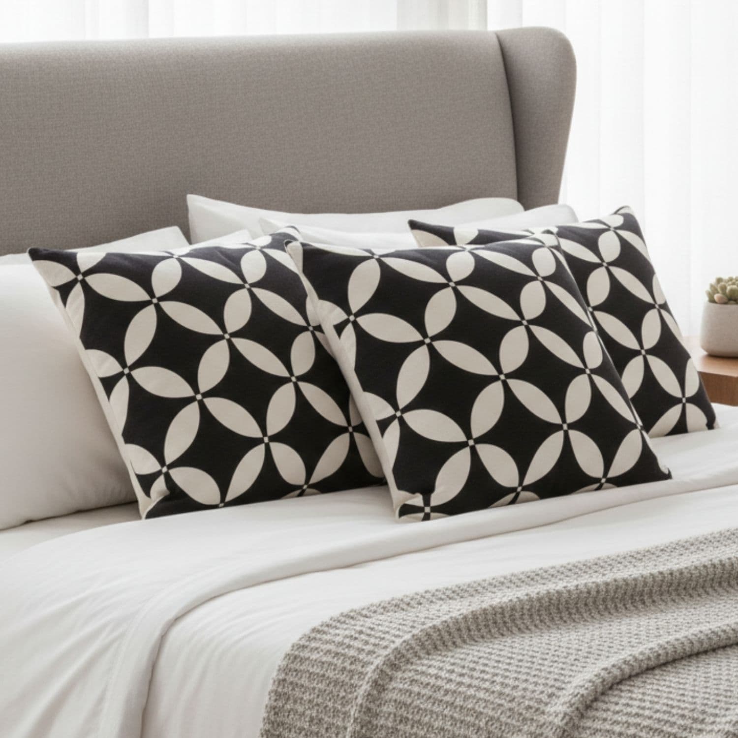 Loosebucket Black Luxury cushion covers Black and white patterned cushions  on a bed with a neutral headboard.
