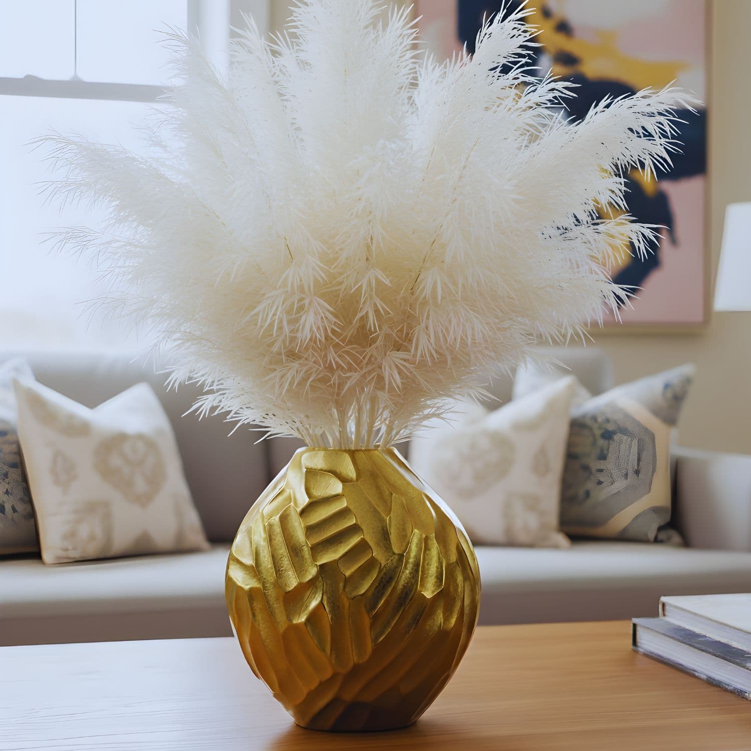 Loosebucket THE STARRY SWIRL Aluminum Vase, Golden vases placed on table and beautiful living room setting behind