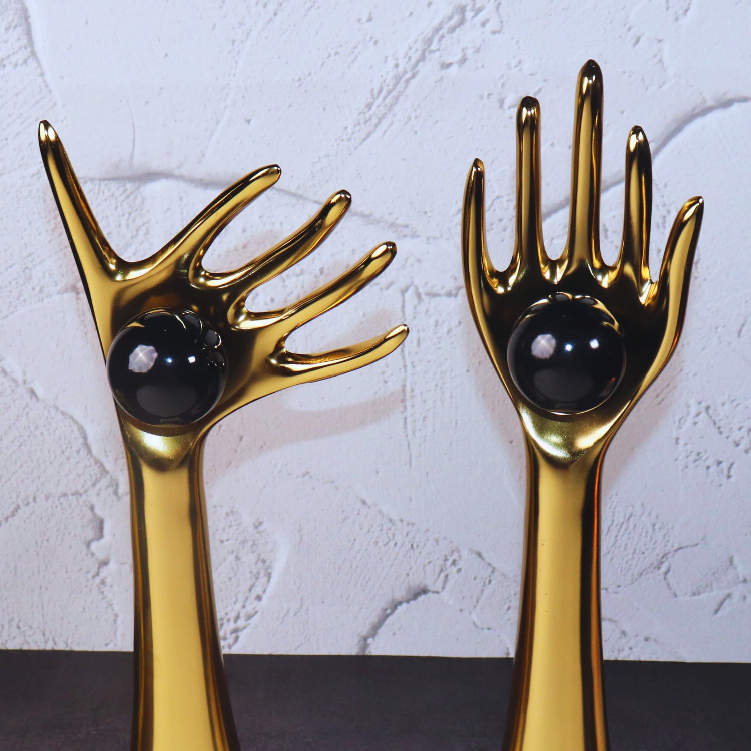 The Golden auspicious hands holding balls in aluminum set of 2
