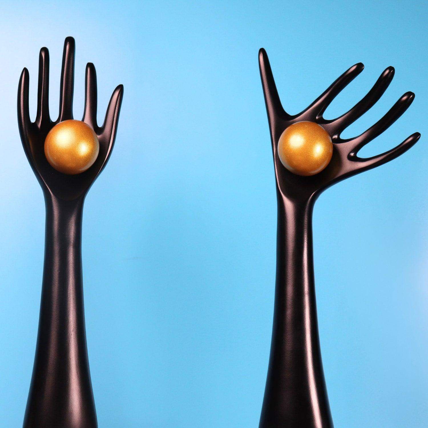 The auspicious hands holding balls in aluminum set of 2