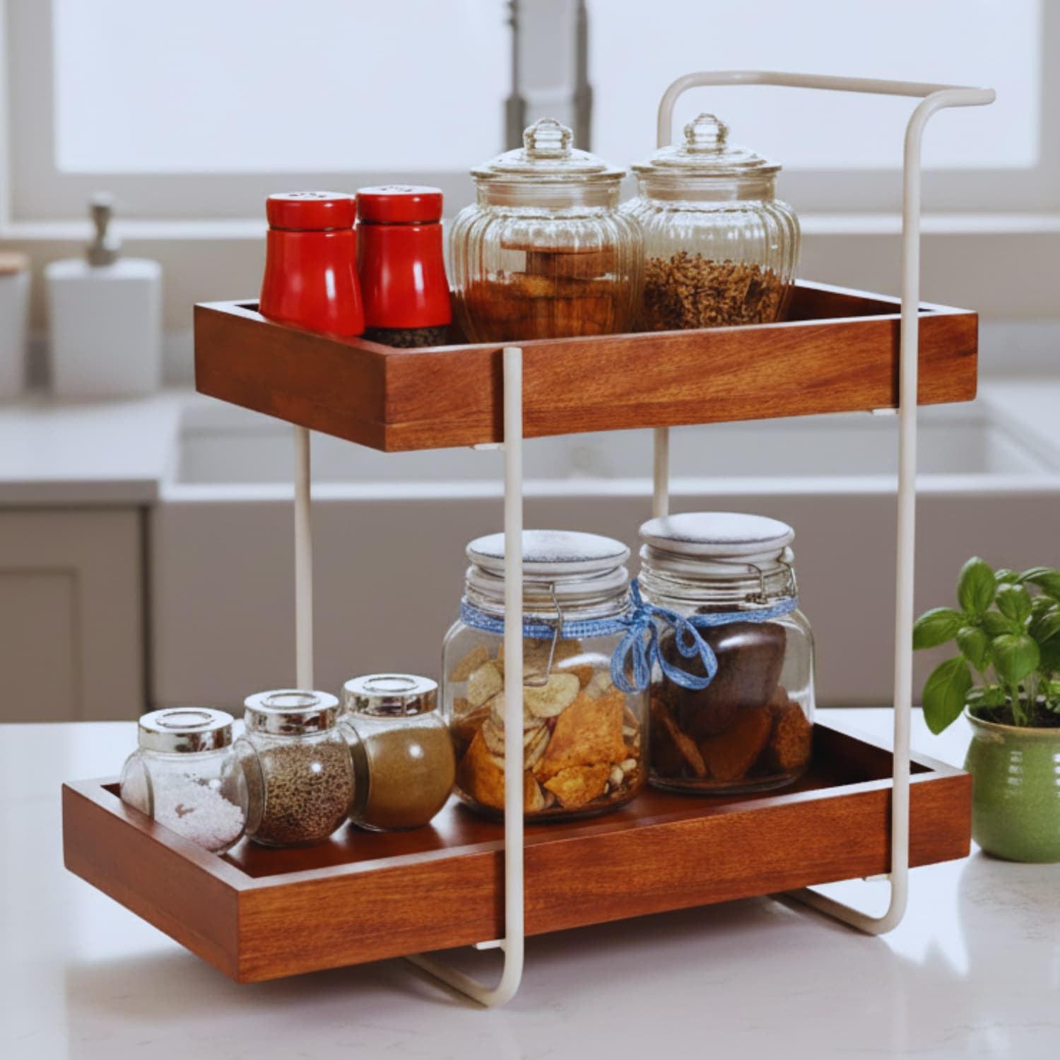 Loosebucket Woodnest Wooden kitchen Organizer with glass jars containing spices and ingredients on a kitchen counter.