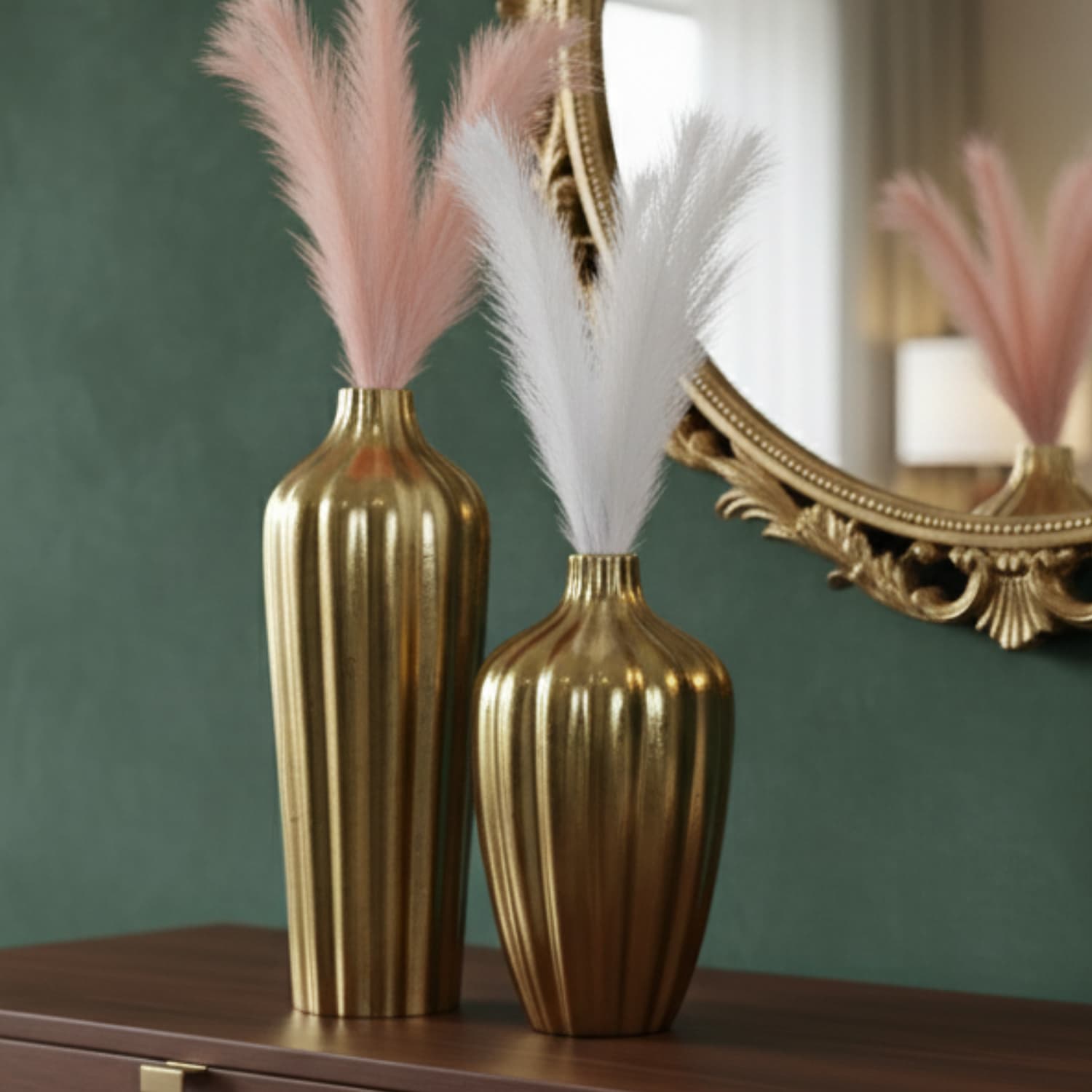 Loosebucket Premium Golden Aurora's Embrace Aluminum Vase with pink and white feathers on a wooden surface with a mirror in the background.